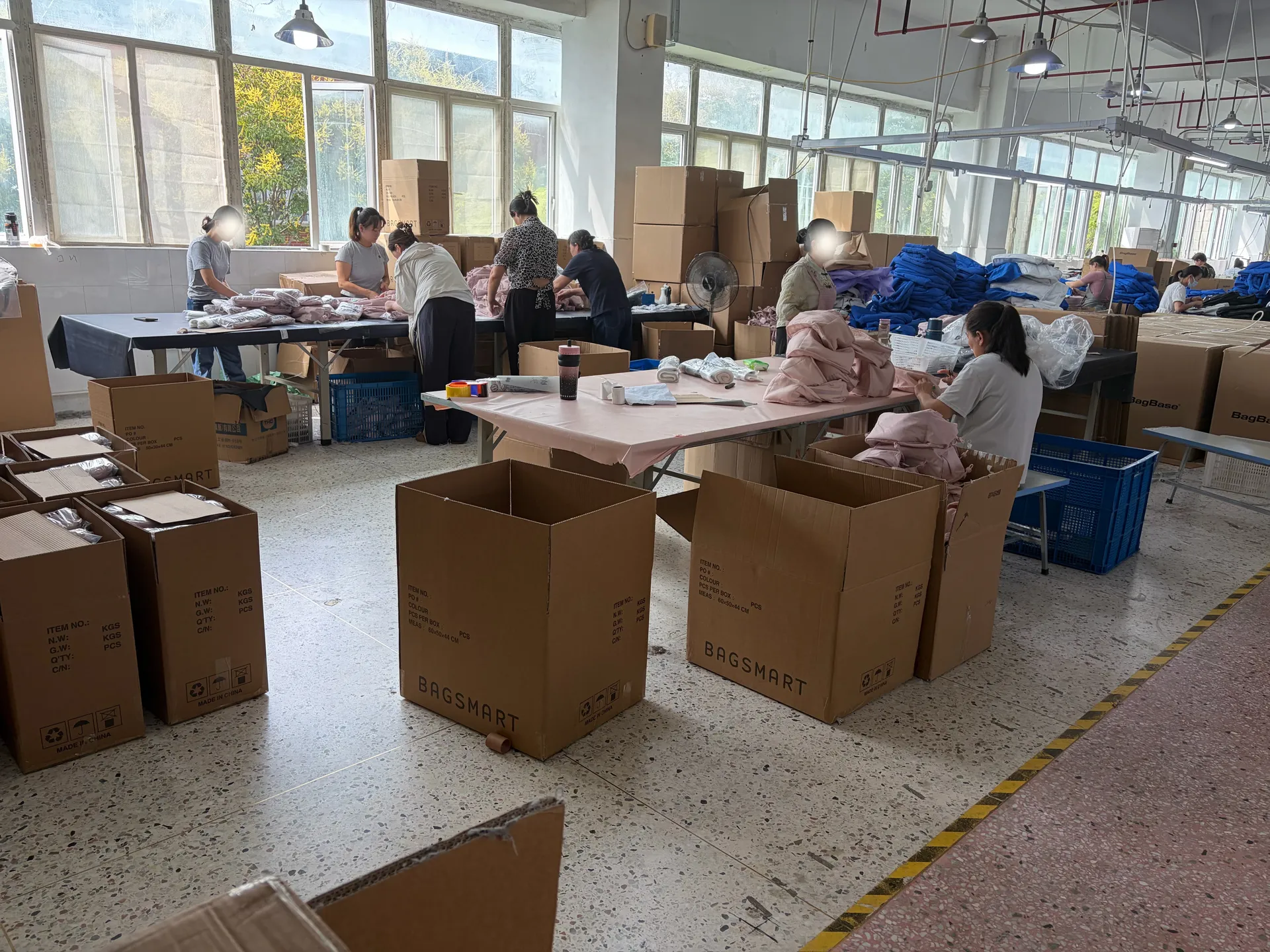 Packing workshop with finished goods being prepared for shipment